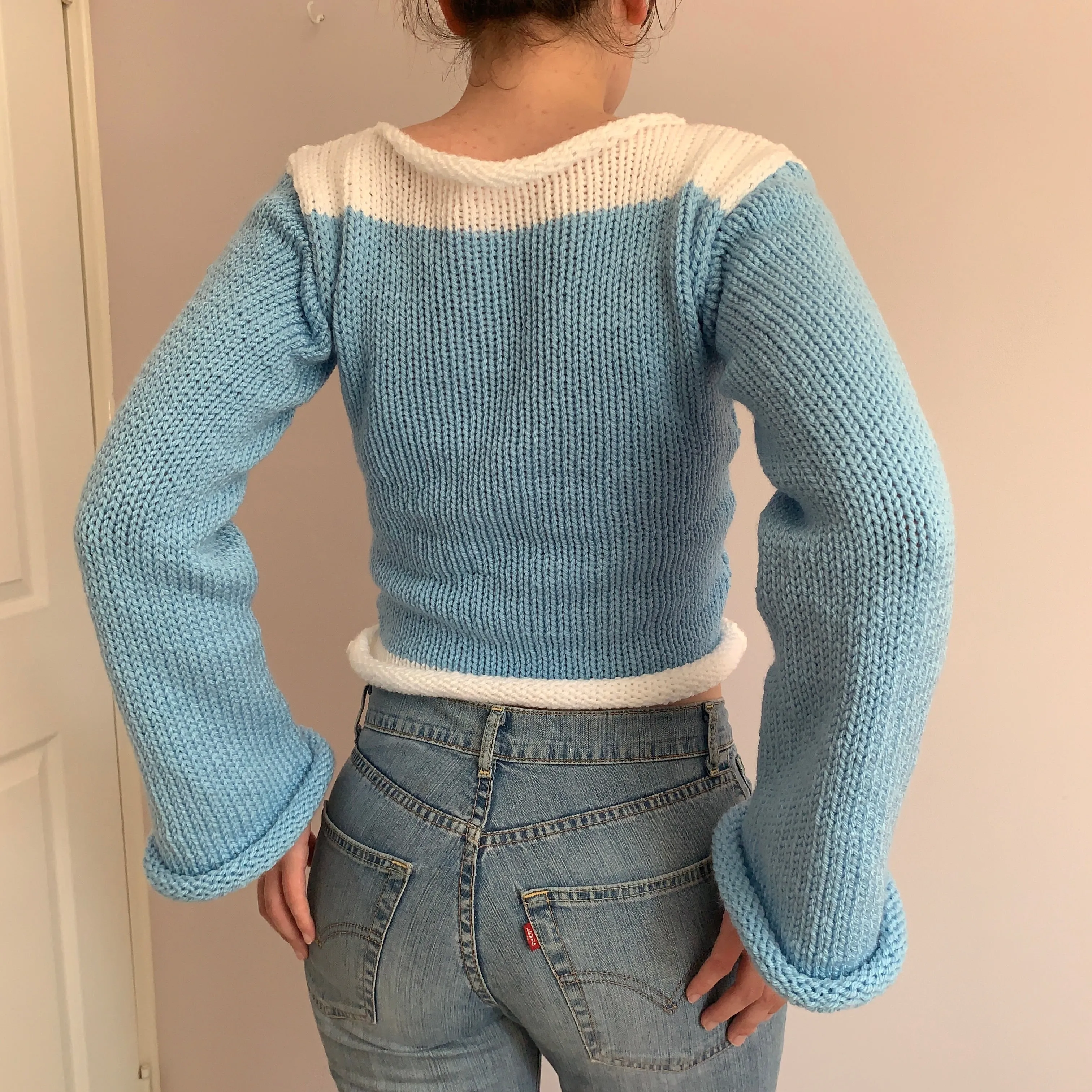 Handmade knitted colour block jumper in baby blue and white