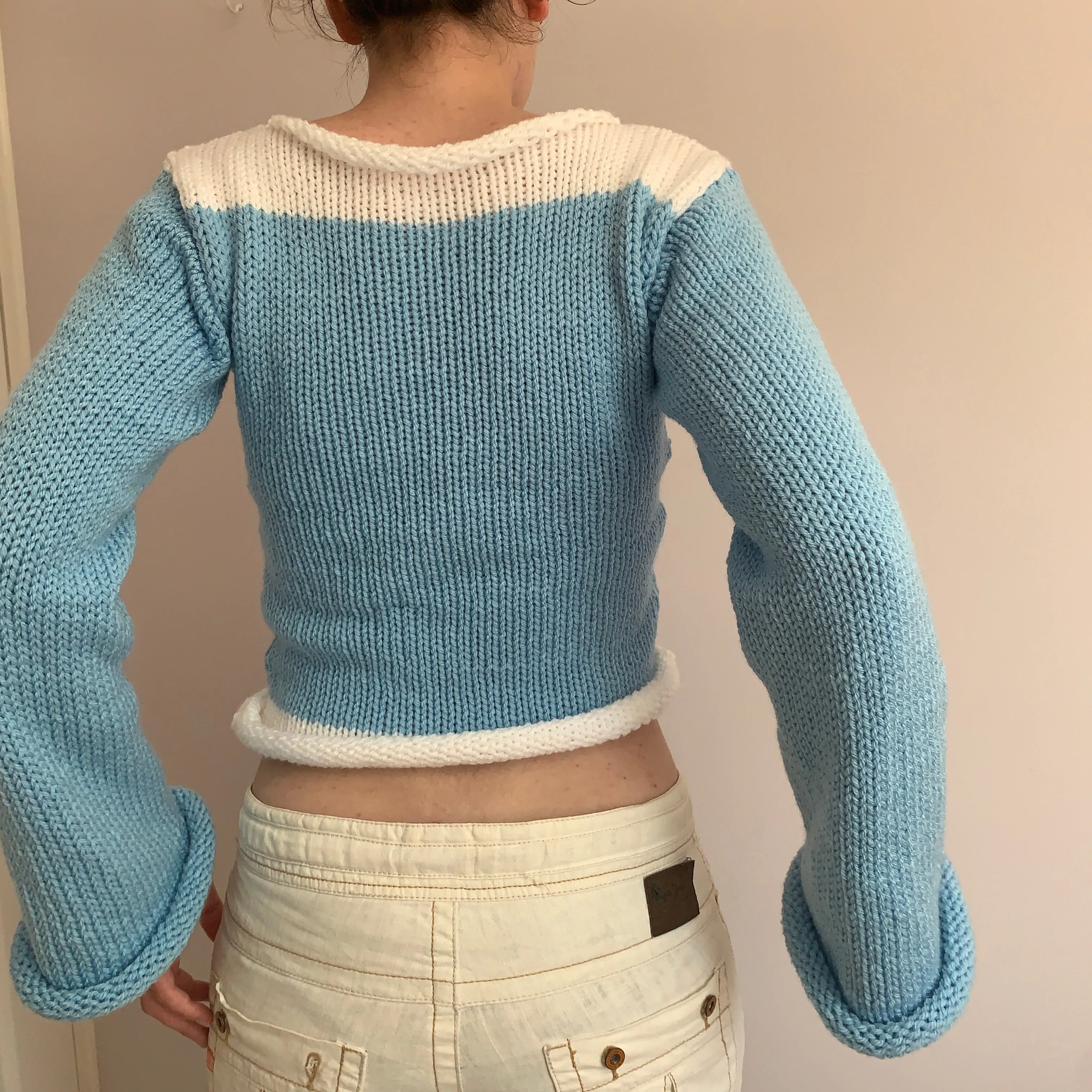 Handmade knitted colour block jumper in baby blue and white